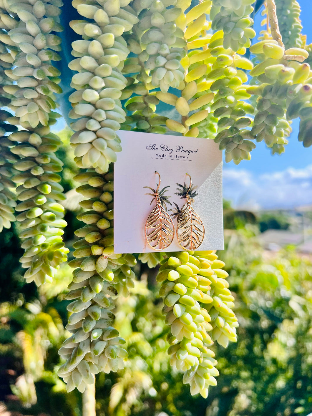 Gold palm teardrop earrings