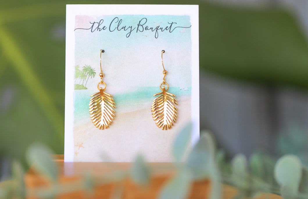 Gold small palm leaf earrings