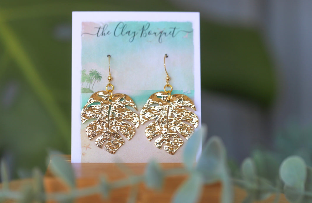 Gold monstera earrings